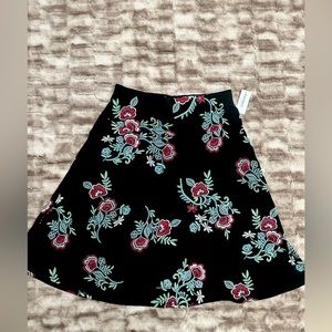 Dress Barn black skirt with floral design, size medium